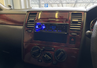 Подержанный автомобиль Nissan Tiida Sedan 2006 года (12 фото)