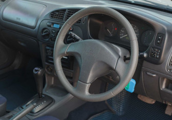 Подержанный автомобиль Mitsubishi Mirage Hatchback 1997 года (10 фото)