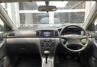 Подержанный автомобиль Toyota Corolla Sedan 2003 года (10 фото)