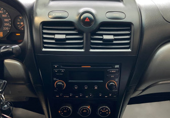 Подержанный автомобиль Nissan Almera Classic 2008 года (9 фото)