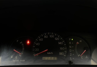 Подержанный автомобиль Toyota Corolla Sedan 2003 года (11 фото)