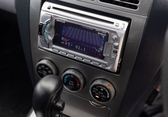 Подержанный автомобиль Nissan Wingroad 2002 года (13 фото)