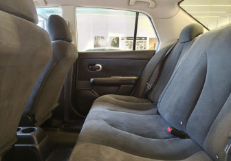 Подержанный автомобиль Nissan Tiida Sedan 2013 года (13 фото)