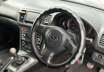 Подержанный автомобиль Subaru Legacy Sedan 2004 года (11 фото)